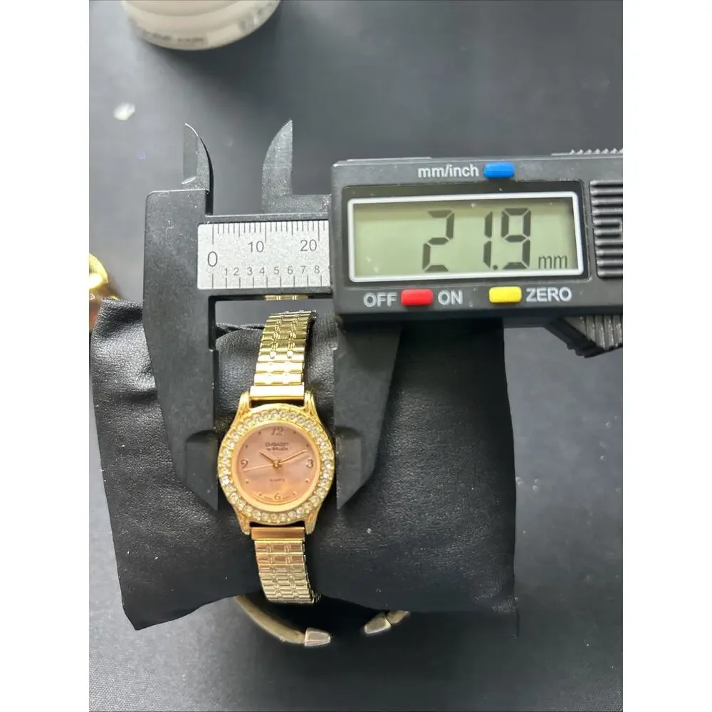 Embassy By Gruen Gold Tone Pink Dial Women’s Stretch Band Quartz Watch